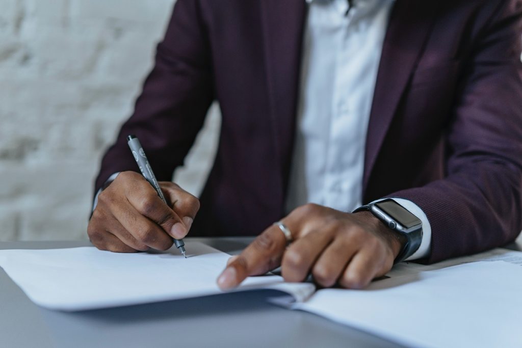 man filling out forms for divorce